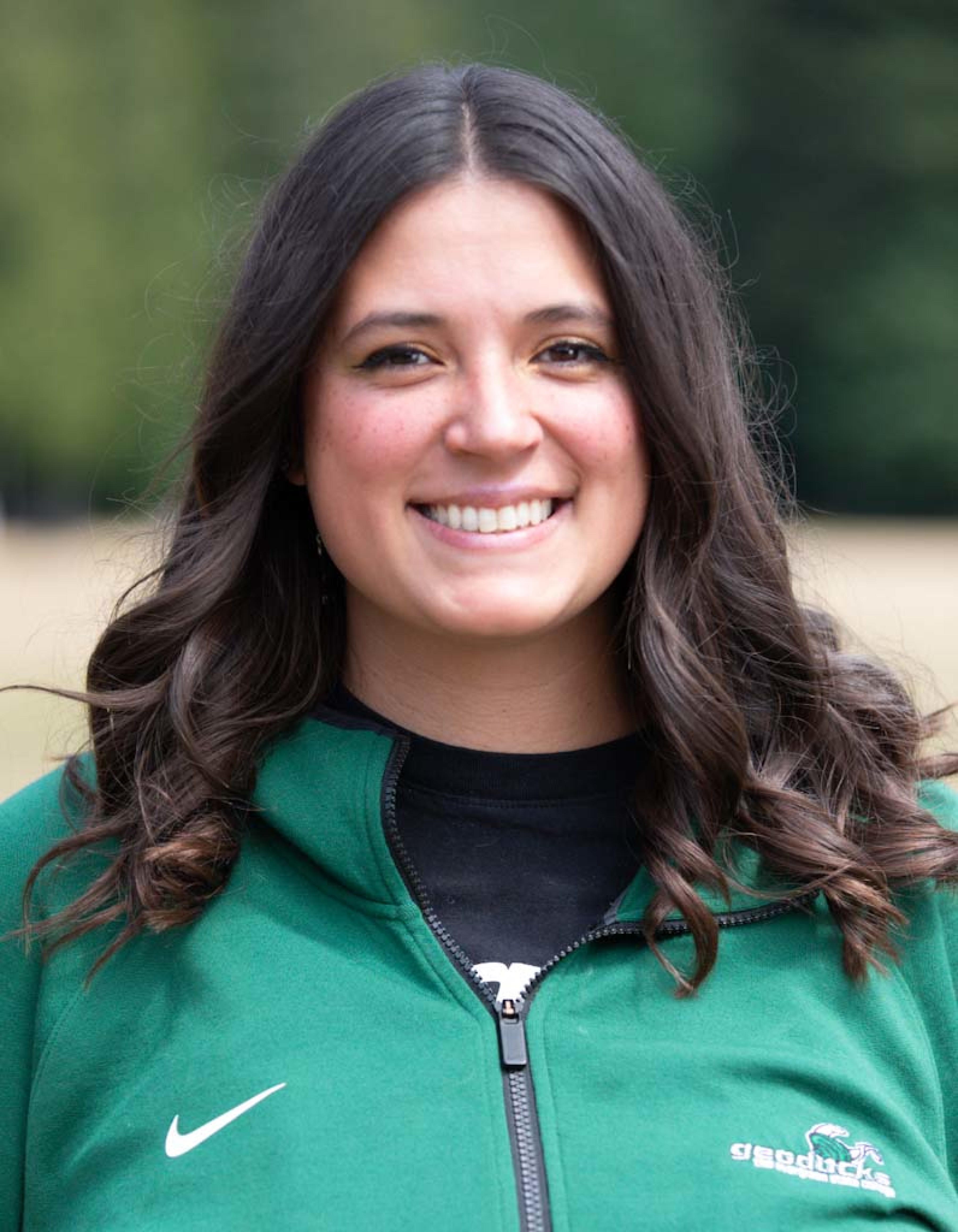 Headshot of Carissa Bounds wearing a green, Evergreen jacket, 