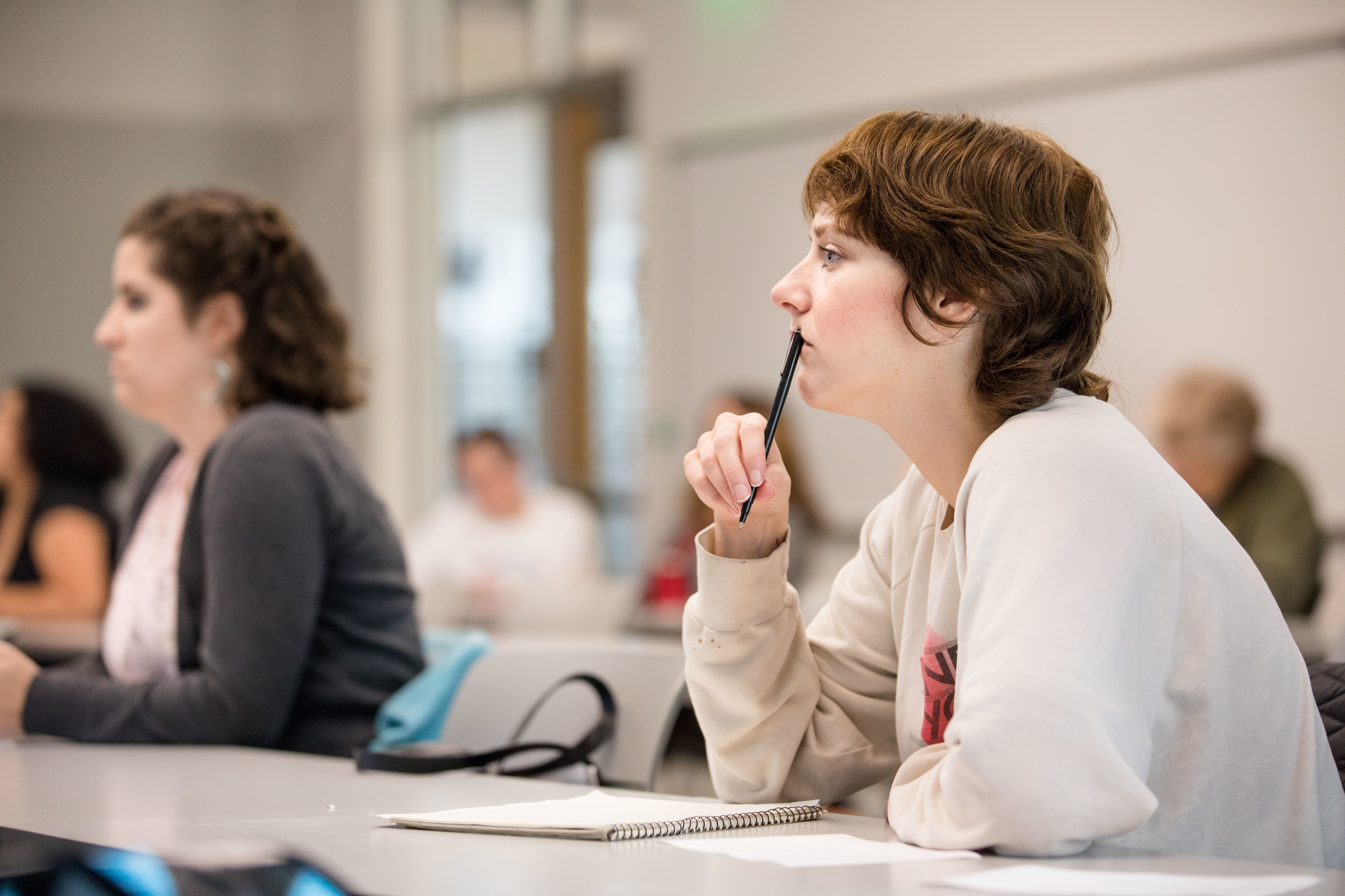 profile of student sitting at desk