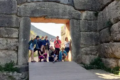 a group of students under an archway