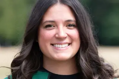 Headshot of Carissa Bounds wearing a green, Evergreen jacket, 