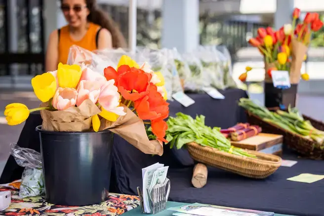 produce and flowers at the farm stand on red square