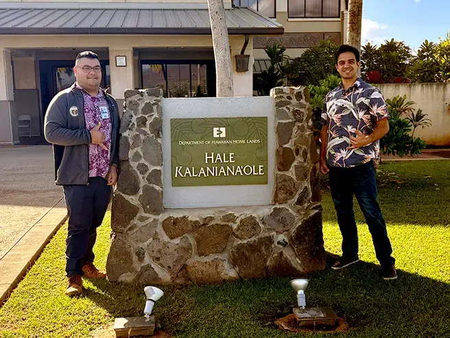 Jaren Tengan (L) with Keith Adams (R) standing outside their workplace, Department of Hawaiian Homelands, in Hawaii.