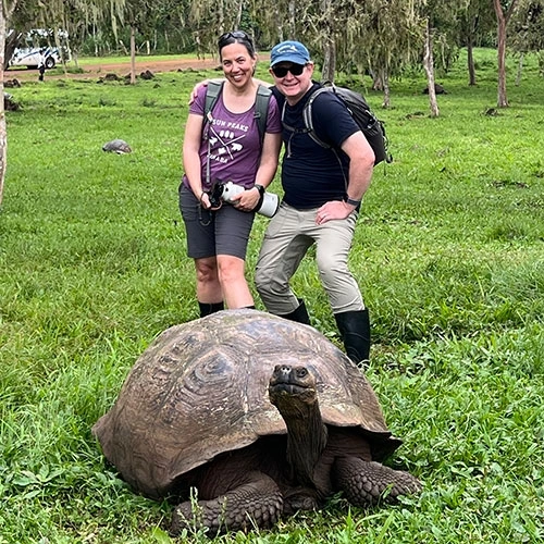 Brian Trinen and Nancy Gleason pose with a tortoise