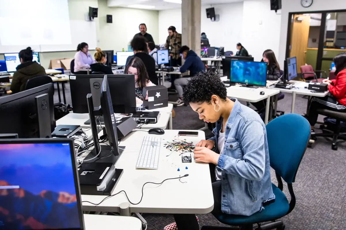 Upward Bound students program computers