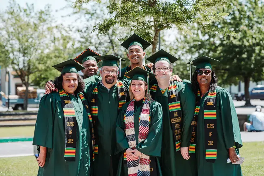 a group of tacoma students standing together after graduation