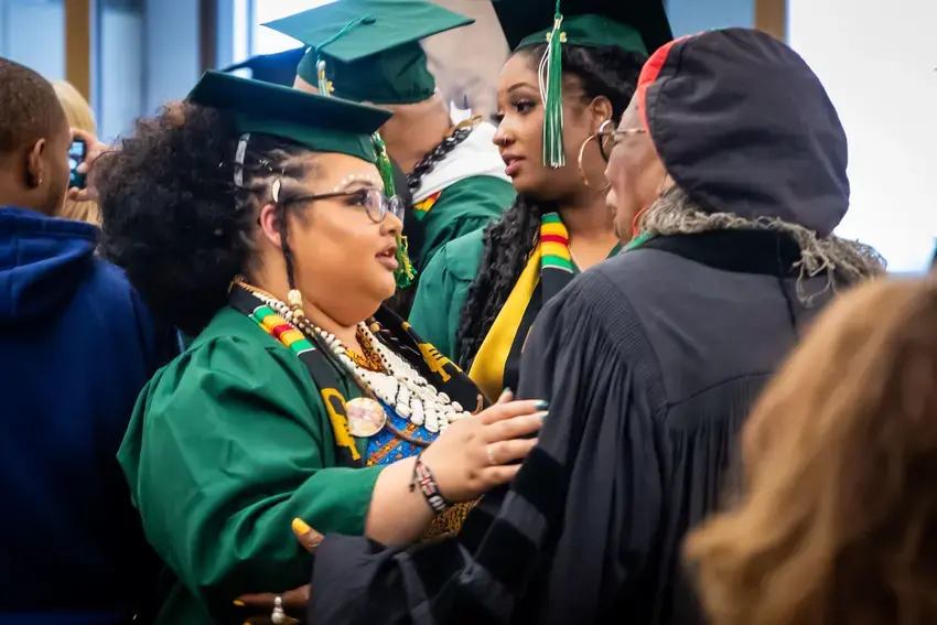 Tacoma graduate celebrates with campus co-founder, Dr. Joye Hardiman